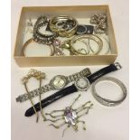 A gold coloured box of mixed jewellery and watches to include Oasis watch and necklases.