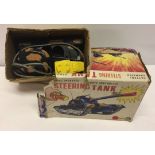 A Marx Toys boxed remote controlled, battery operated Steering Tank. Box in poor condition.