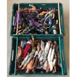 A crate of Action Man villian dolls together with a crate of Action Men in varying conditions.