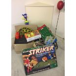 A large quantity of vintage toys and games to include Parker Striker and tinplate football game.