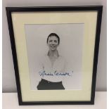 A framed and glazed signed black & white photo of Annie Lennox. Size approx 18 x 23cm.