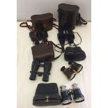 3 pairs of vintage binoculars in leather cases together with 2 pairs of cased opera glasses.
