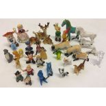 A vintage collection of miniature china and early plastic figures to include 12 Walt Disney and
