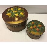 2 wooden round boxes with hand painted lids. Large box decorated with lemons and smaller box