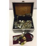 An aluminium jewellery carry case full of costume jewellery and ladies & gents watches.