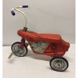 A c1960-70s Tri-ang childs motorbike trike.