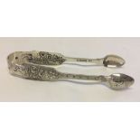 A pair of Irish silver decorative sugar tongs. Hallmarked - Dublin 1881.