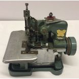 A vintage desktop motorised 'Butterfly' sewing machine, made in china.