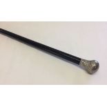 A silver topped walking cane. Hallmarked London 1904.