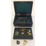 An old jewellery box with misc items to include a Queen Victoria commemorative 50th Jubilee badge