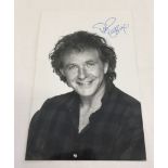 A signed black & white photograph of David Essex.