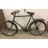 A vintage gents push bike in need of restoration.