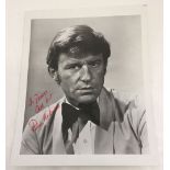 A signed black & white photo of Roddy McDowell.