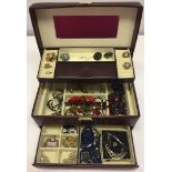A burgandy leather effect large jewellery box with contents.