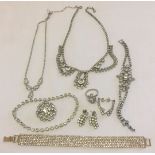 A collection of diamante jewellery to include: necklaces, earrings, bracelets, brooch and ring.