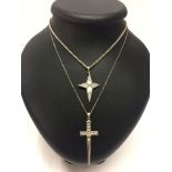 2 large modern design silver crosses on chains. One set with crystals, the other is pearlised and on