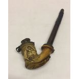 An antique carved Meerschaum pipe with galloping horse detail.