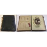 A Victorian photograph album with a number of photos inside (some damage to spine).