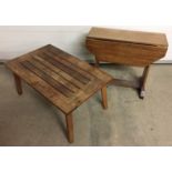 A teak coffee table together with a small drop leaf coffee table.