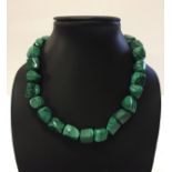 Necklace made from natural green malachite stones of irregular shapes, each approx 1.5cm cubed.