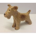 A Sylvac biscuit coloured terrier dog figurine, model # 1121.