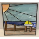 A leaded stained glass panel of boat & harbour scene.