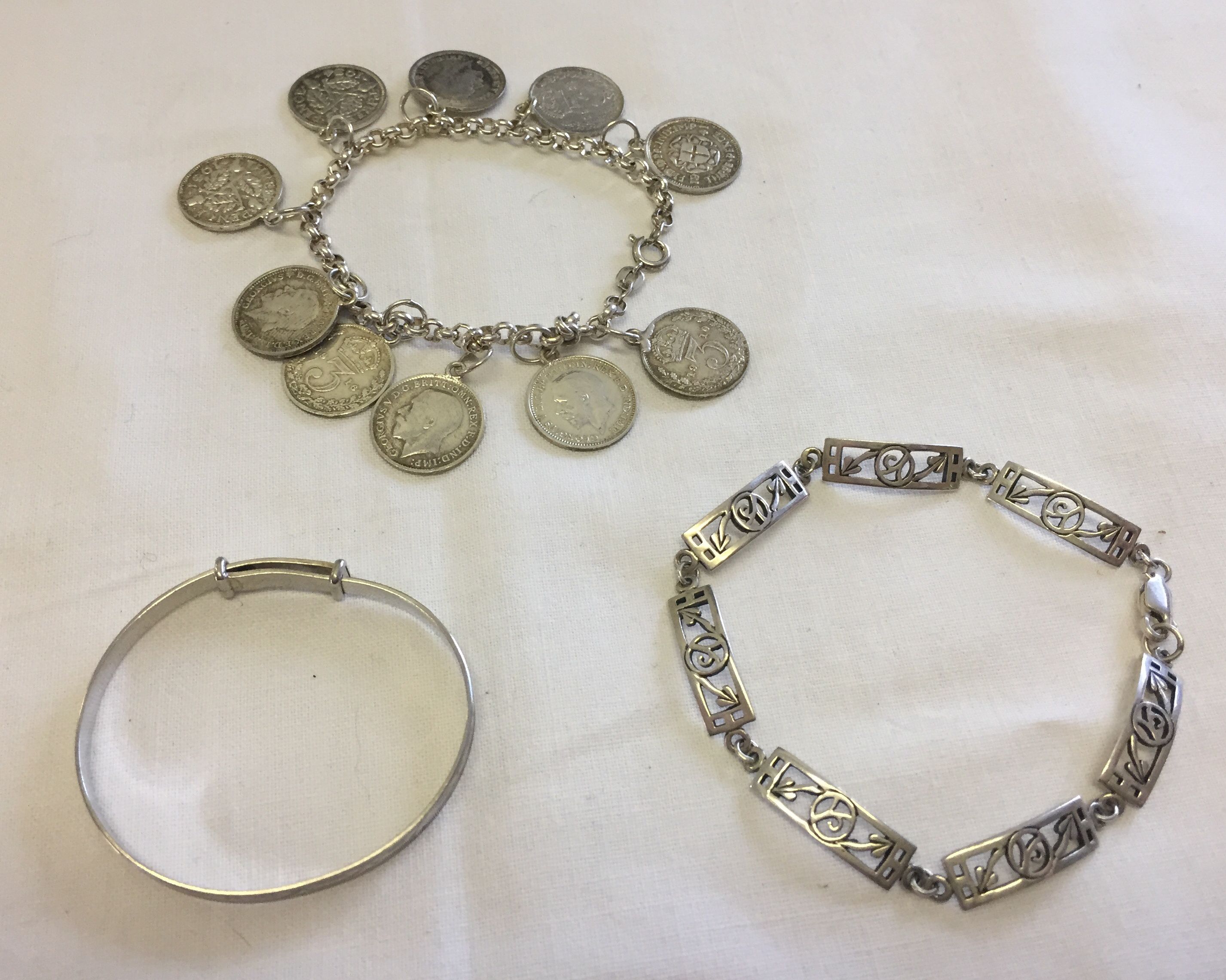 3 silver bracelets comprising, 1. a childs expanding bracelet with the name Kim engraved inside.