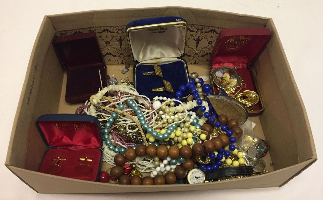 A shoe box of mixed costume jewellery to include beaded necklaces, cufflinks and earrings.