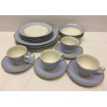 A Doulton 4 place setting in pale blue and white with gilt bands comprising 4 cups and saucers, 4