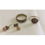 3 jewellery items to include a pair of 9ct gold stud earrings and pretty gold metal band ring.