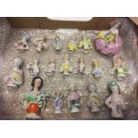 A collection of 18 ceramic half dolls to include a lidded trinket box.