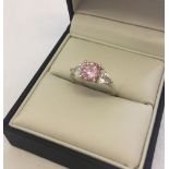 Silver dress ring set with pink and clear cubic zirconias. Size P.