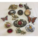 A small tub of costume jewellery brooches to include Mispah, micro mosaic and Scottish natural