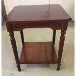 A small polished wood square table. Approx 51 x 55cm.