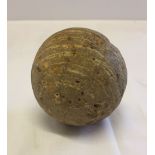 An antique stone canon ball. 8cm diameter.