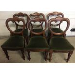 A set of 6 Victorian balloon back shaped chairs with green velvet upholstery.