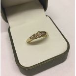 9ct gold solitaire diamond ring with ornate shoulders. Diamond weight 0.10, ring weight approx 2.3g,