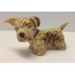 A Sylvac biscuit coloured dog figurine, model # 1122.