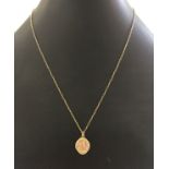 A 9ct gold St. Christopher on 9ct gold chain total weight 2.3g.