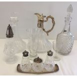 A box of glassware to include a Stewart crystal decanter, cruet set and sugar sifter.