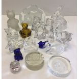 A quantity of glass paperweights and animal figurines to include lead crystal examples.