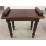A small mahogany table/stool with turned legs.