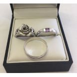 3 rings comprising - 1. Hallmarked ring with a rose and heart design shoulders, size N, 2. 925 plain