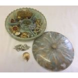 A vintage plastic jewellery box with a selection of costume jewellery items to include Sarah