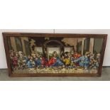 A framed tapestry depicting The Last Supper. Approx 42 x 93cm.