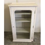 A glass fronted painted pine cupboard with key. 66cm wide x 110cm high.