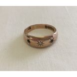 A vintage 9ct gold gypsy style ring with central diamond. 2 other stones missing. Total weight