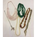 A quantity of costume jewellery bead necklaces to include rose quartz.