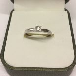 Modern 9ct white gold solitaire diamond ring. Diamond weight 0.05, ring weight approx 1.4g, size