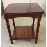 A small polished wood square table. Approx 51 x 55cm.